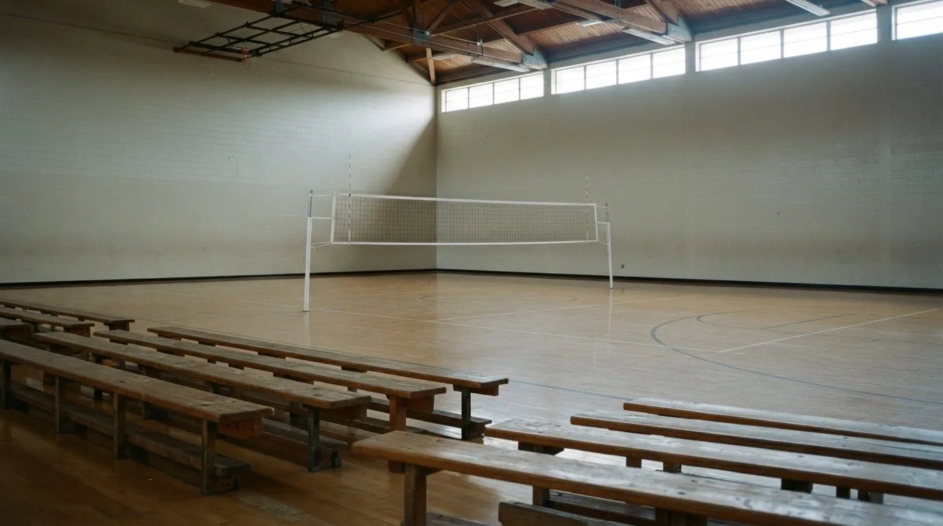 An empty courtroom with wooden benches in morning light